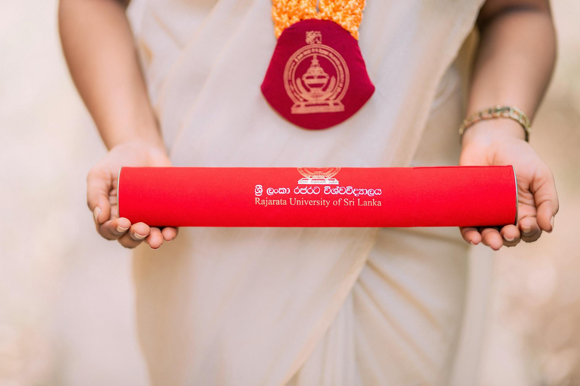 graduate holding diploma from rajarata university